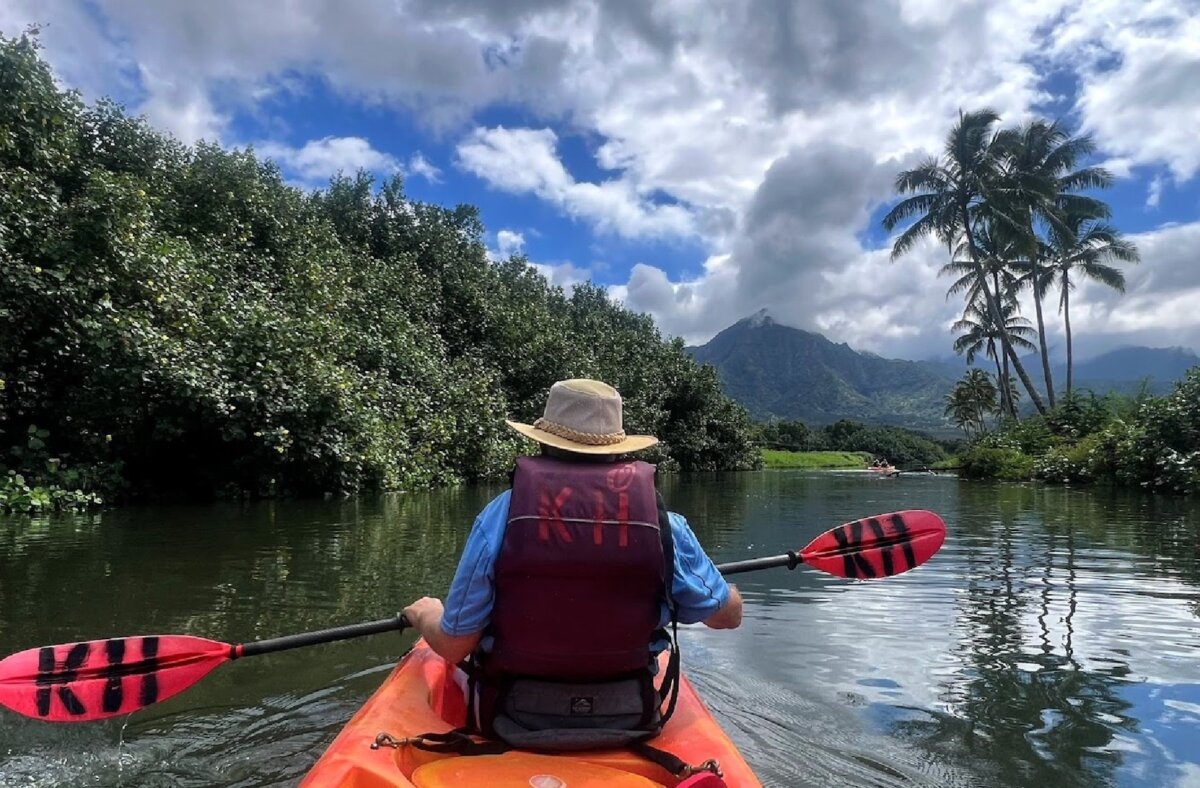 The author kayaks along the Na Pali coast of Kaua'i, Hawaii. (Photo courtesy of Jim Farber)