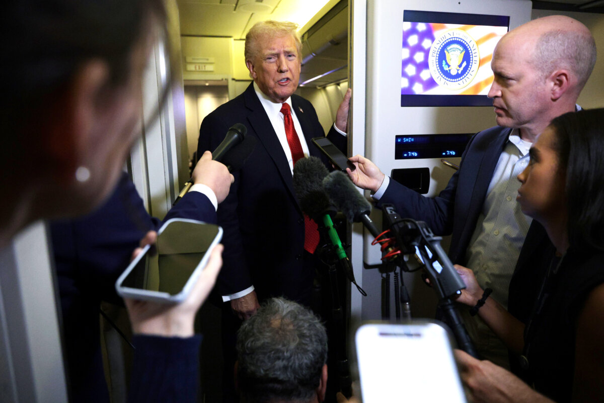 President Donald Trump speaks to reporters aboard Air Force One on Oct. 19, 2025. (Alex Wong/Getty Images)