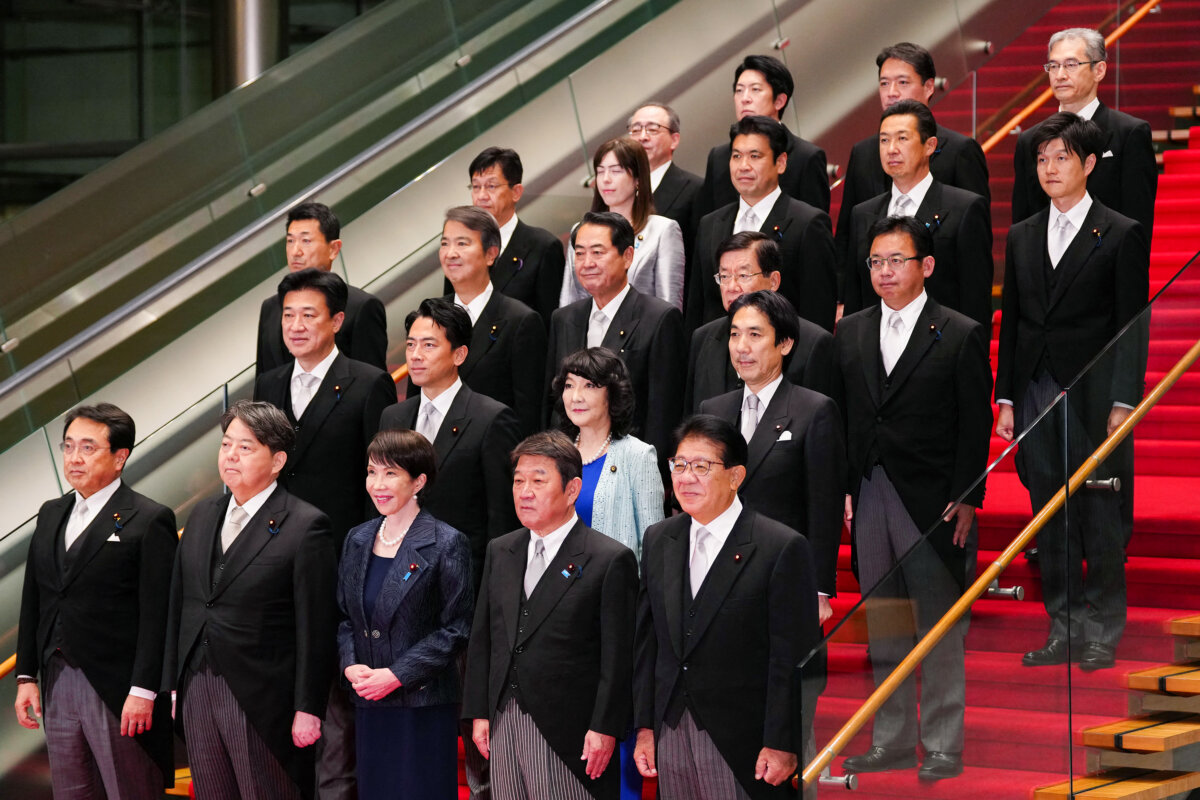 Japanese Prime Minister Sanae Takaichi (C, front row) poses during a photo session with members of her cabinet at the prime minister's office in Tokyo on Oct. 21, 2025. (Jia Haocheng/AFP via Getty Images)