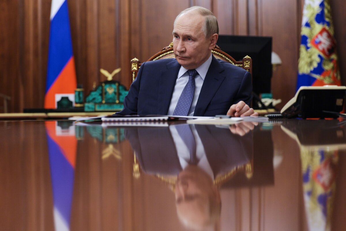 Russian President Vladimir Putin listens to the head of the Federal Service for Supervision of Natural Resources (Rosprirodnadzor) Svetlana Radionova during their meeting at the Kremlin in Moscow, Russia, on Oct. 21, 2025. (Alexander Kazakov, Sputnik, Kremlin Pool Photo via AP)
