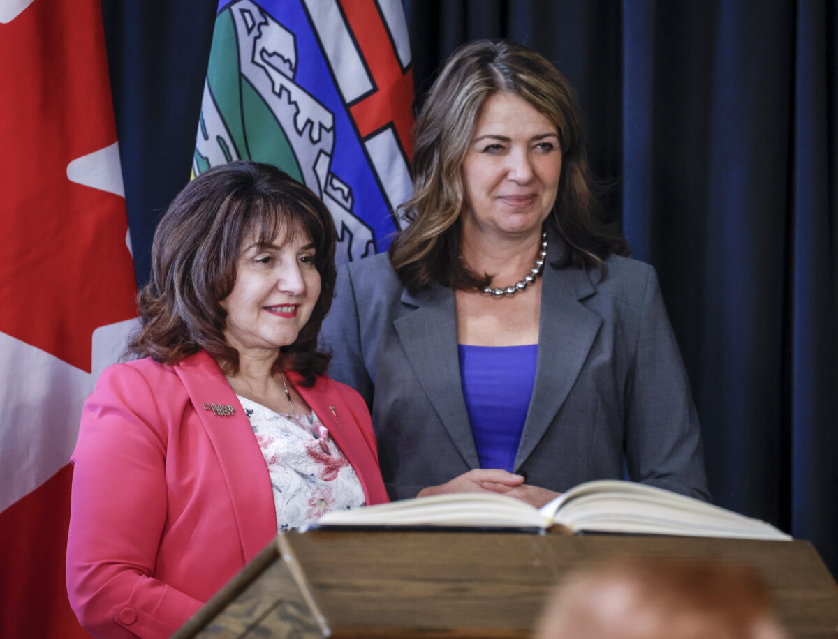 Alberta Premier Danielle Smith (R) stands with Health Minister Adriana LaGrange following a swearing-in ceremony in Calgary on May 16, 2025. (The Canadian Press/Jeff McIntosh)