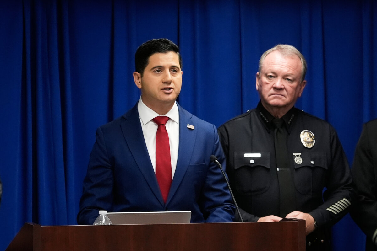 Acting U.S. Attorney Bill Essayli (L) speaks next to Los Angeles Police Chief Jim McDonnell during a news conference announcing an arrest made in the Palisades Fire in Los Angeles on Oct. 8, 2025. (Damian Dovarganes/AP Photo)