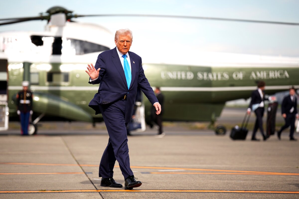 President Donald Trump waves as he prepares to board Air Force One to depart for South Korea at Haneda Airport in Tokyo, Japan, on Oct. 29, 2025. (Andrew Harnik/Getty Images)