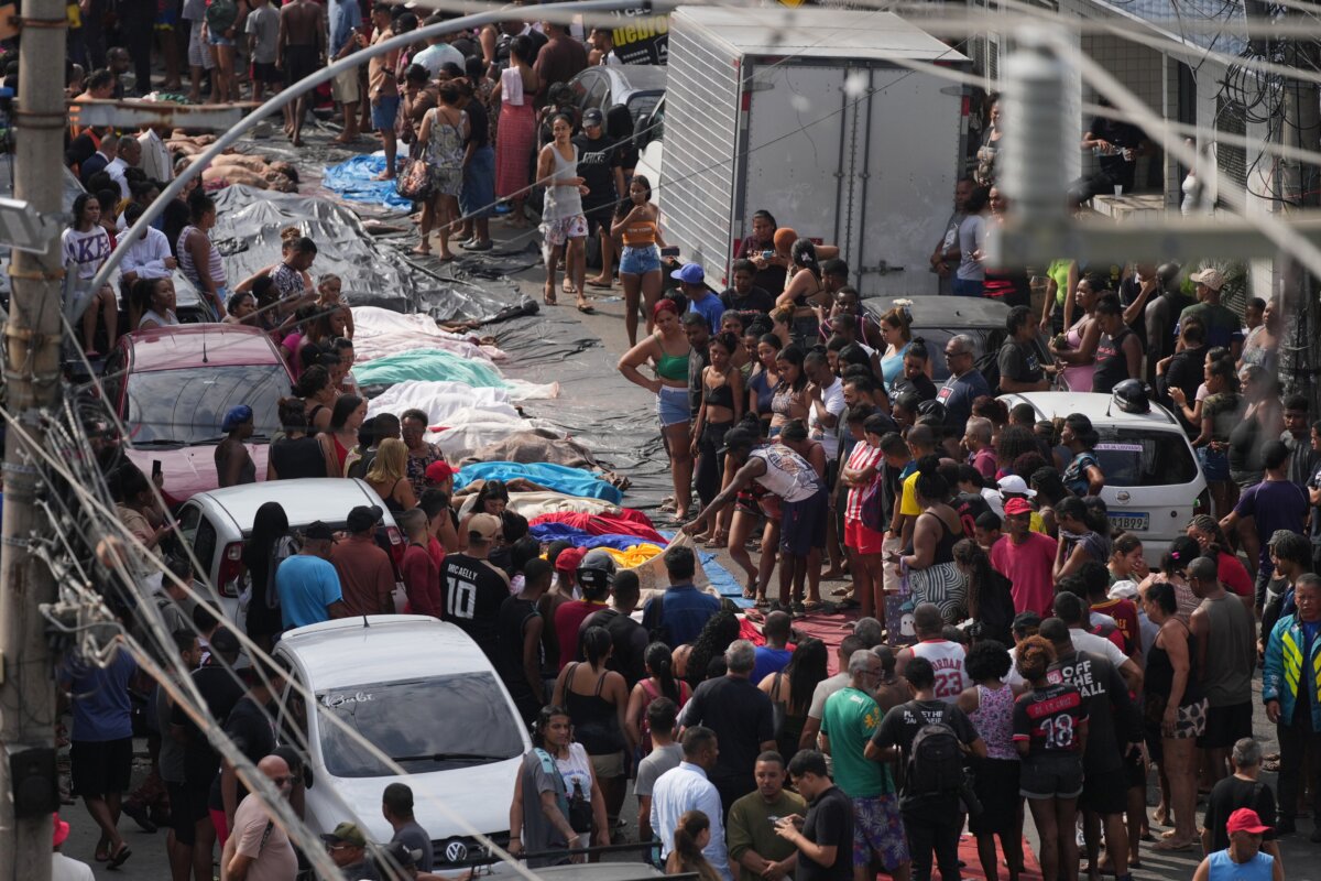 Residents surround the bodies of people killed the day before during a police raid targeting the Comando Vermelho gang in the Complexo da Penha favela of Rio de Janeiro on Oct. 29, 2025. (Silvia Izquierdo/AP Photo)