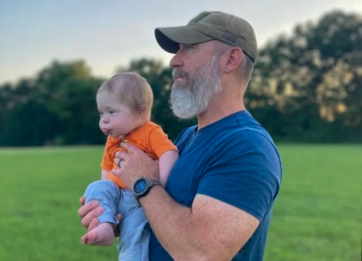 Author Andrew Daub holds his son, Iron Will, whose joy inspires his mission to champion the worth of every child with Down syndrome. (photo courtesy of Andrew Daub)