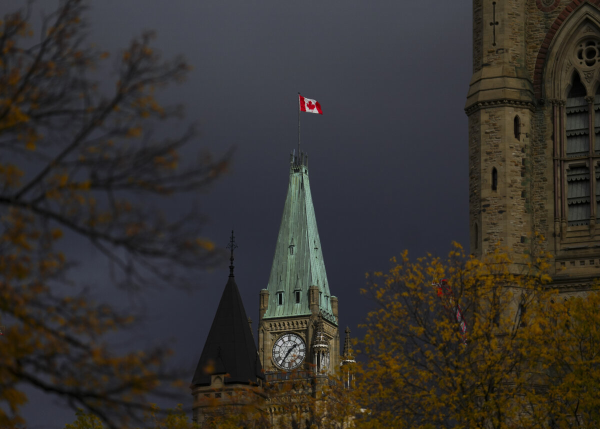The Canadian Flag flies on the Peace Tower on Parliament Hill in Ottawa on Oct. 24, 2025. (The Canadian Press/Sean Kilpatrick)