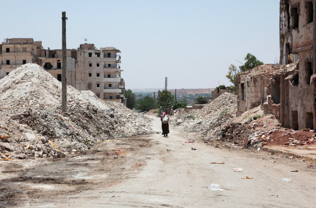 A man walks through the destruction in the city of Aleppo, Syria, on June 23, 2025. (Mahmoud Hassano/Reuters/File Photo)