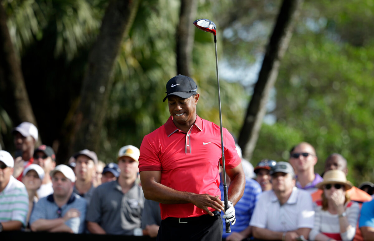 Tiger Woods reacts after teeing off on the 12th hole during the final round of the Cadillac Championship golf tournament in Doral, Fla., on March 9, 2014. (Lynne Sladky/AP Photo)