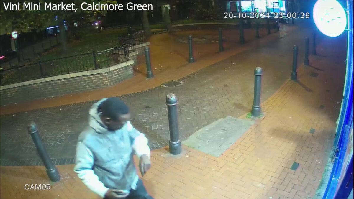 A person said to be Deng Chol Majek entering a store in Caldmore Green after the attack (British Transport Police/PA)