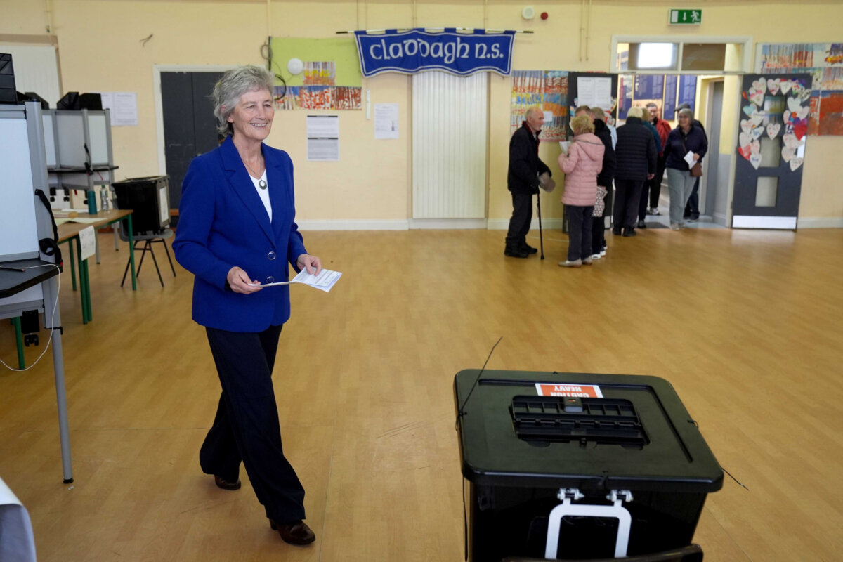 Independent candidate Catherine Connolly casts her vote in the election for the next Irish president at Claddagh National School in Galway city, Ireland, on Oct. 24, 2025. (Brian Lawless/PA via AP)