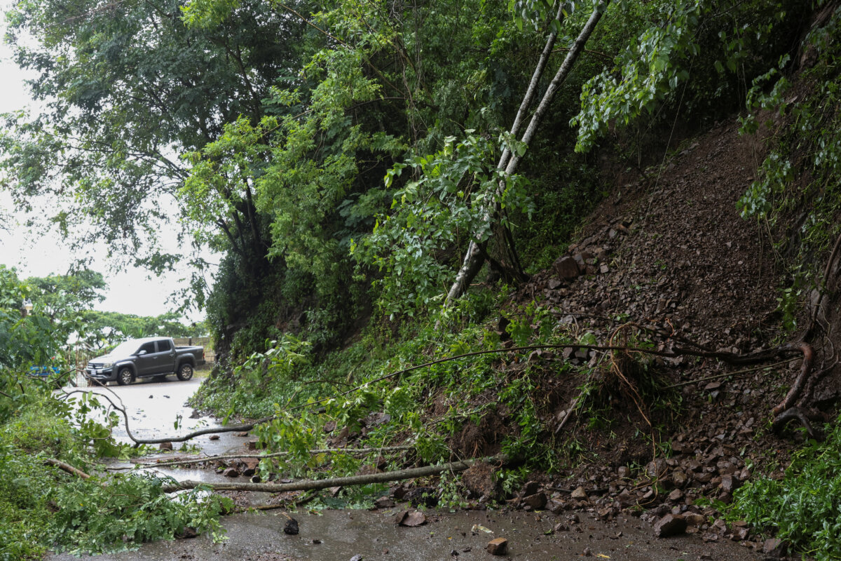 Downed tree branches block a road as Hurricane Melissa approaches, in Gordon Town, Jamaica, on Oct. 28, 2025. (Gilbert Bellamy/Reuters)