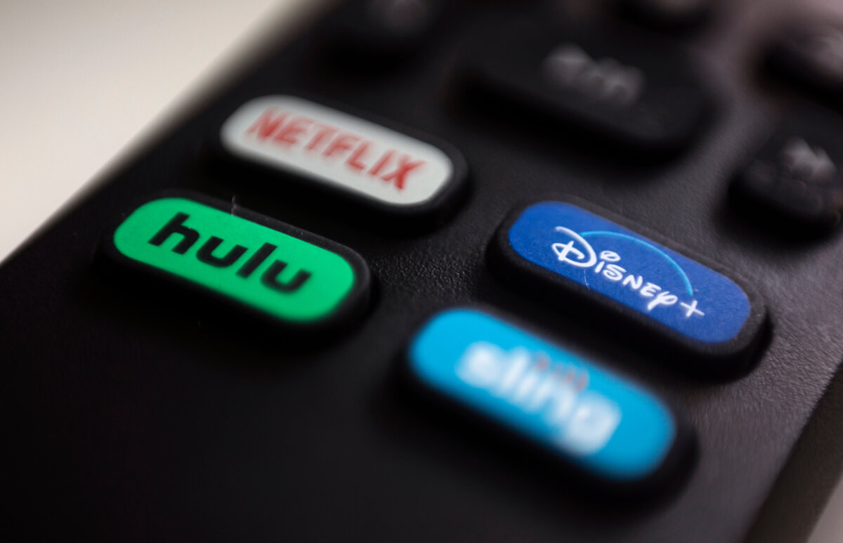 The logos for streaming services Netflix, Hulu, Disney Plus and Sling TV are pictured on a remote control on Aug. 13, 2020, in Portland, Ore. (AP Photo/Jenny Kane, File)