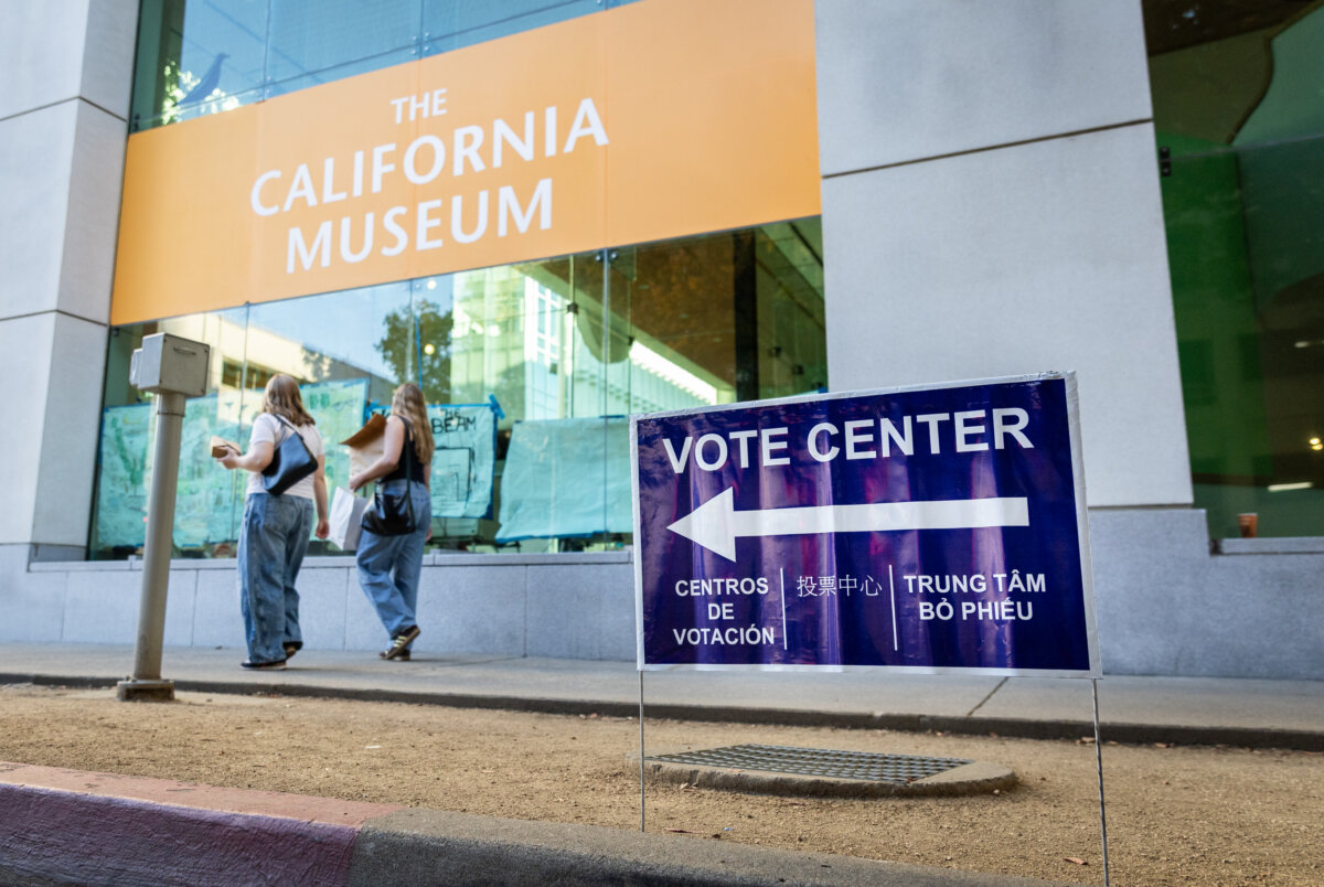 People walk past a voting site at the California Museum in Sacramento, Calif., on Nov. 1, 2025. (John Fredricks/The Epoch Times)