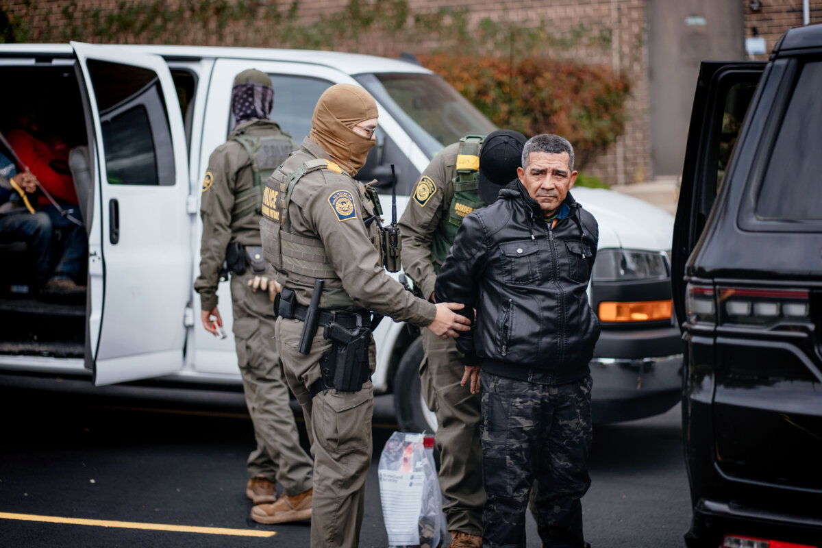 People detained earlier in the day are taken to a parking lot on the far north side of the city before being transferred to an Immigration and Customs Enforcement facility in Chicago on Oct. 31, 2025. (Jamie Kelter Davis/Getty Images)