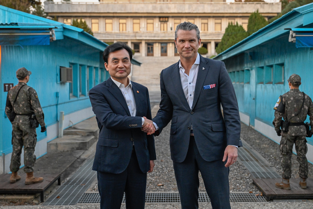 Secretary of War Pete Hegseth (R) shakes hands with South Korean Defense Minister Ahn Gyu Back (L) at the southern side of Panmunjom in the Demilitarized Zone, South Korea, on Nov. 3, 2025. (South Korea Defense Ministry via AP)