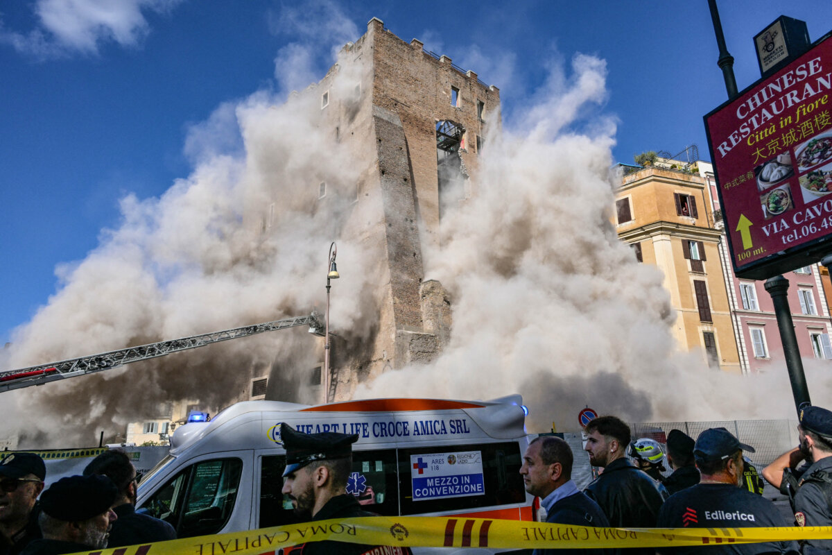 Dust rises due to a second collapse of part of the medieval tower "Torre dei Conti" near the Roman Forum in the historic center of Rome on Nov. 3, 2025. (Tiziana Fabi/AFP via Getty Images)