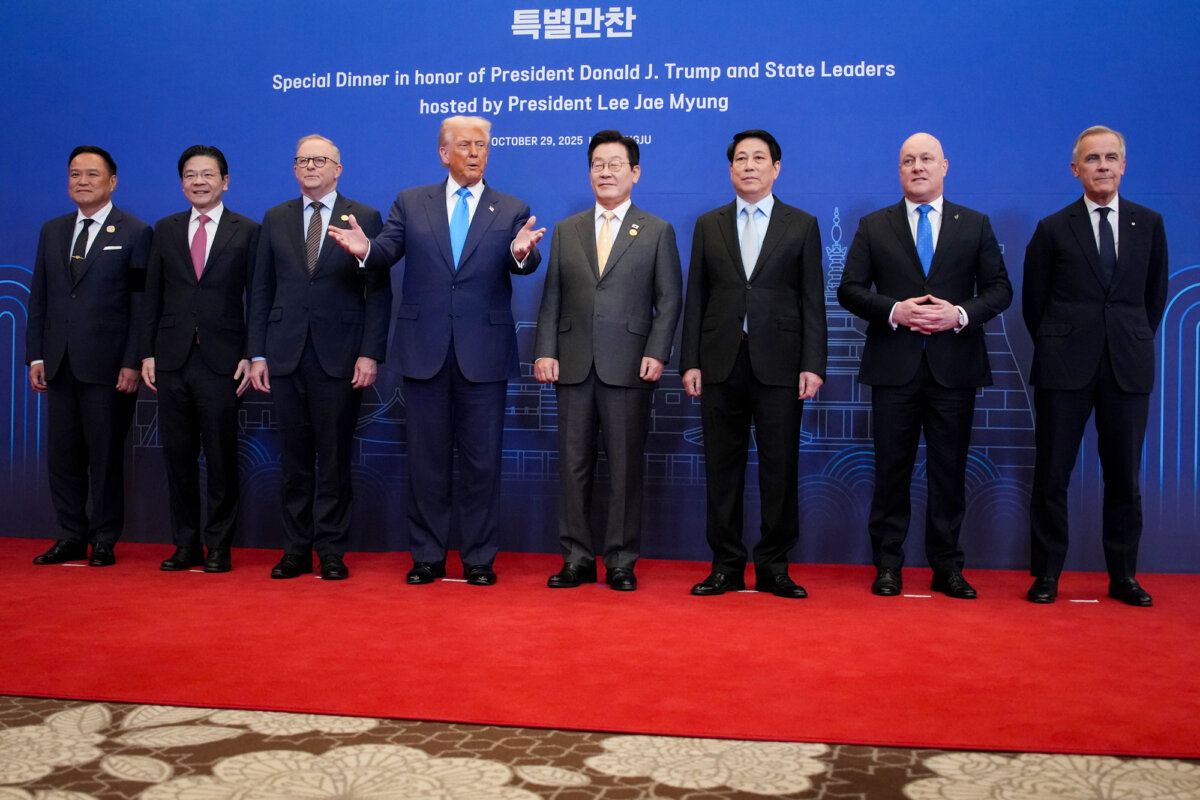 APEC leaders pose for a group photo before a dinner honoring U.S. President Donald Trump (4th-L) during APEC meetings at the Hilton Gyeongju in Gyeongju, South Korea, on Oct. 29, 2025. The Trump administration has secured trade deals with several countries, including the United Kingdom, the European Union, Japan, and South Korea. (Andrew Harnik/Getty Images)