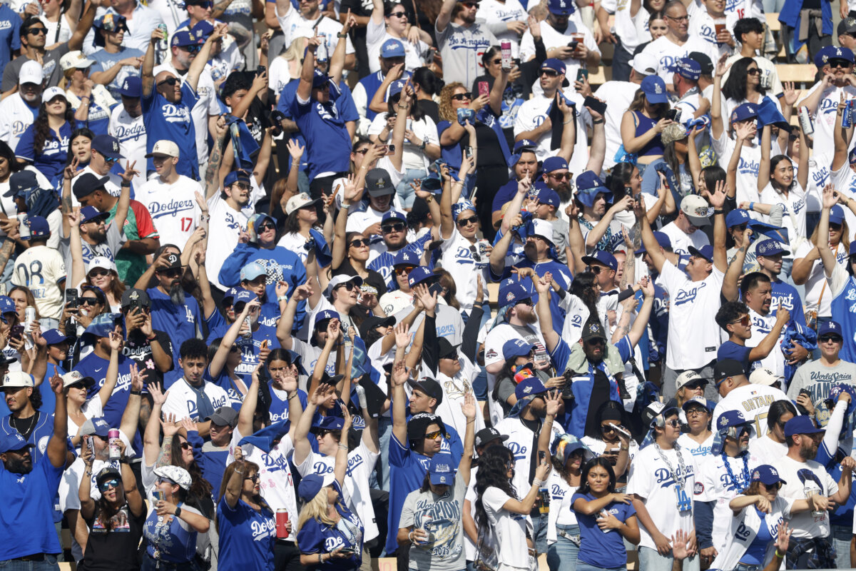 Baseball's enduring national anthem captures the communal joy and atmosphere of the sport. (Photo by Ronald Martinez/Getty Images)