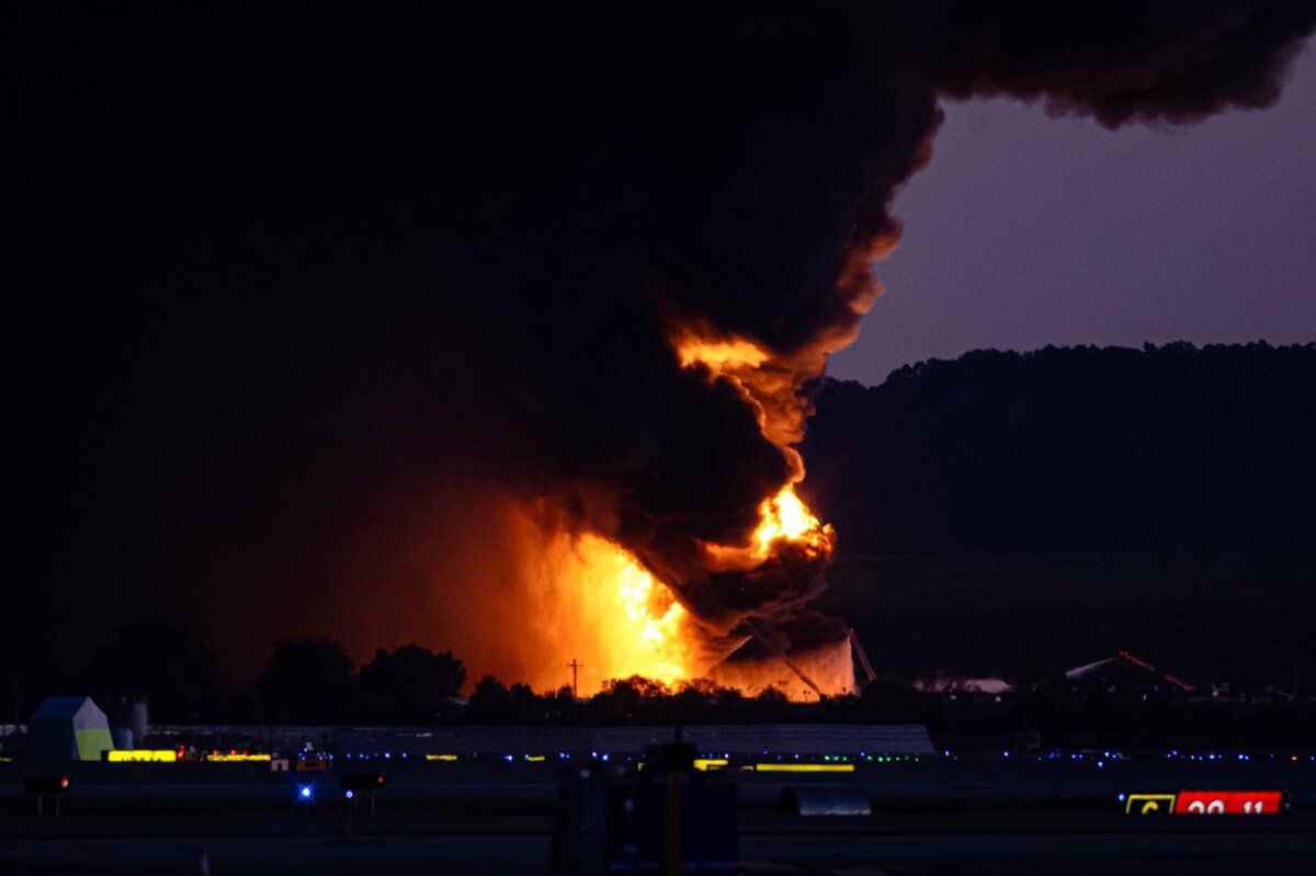 A fireball erupts near airport property after reports of a plane crash at Louisville International Airport in Louisville, Ky., on Nov. 4, 2025. (Jon Cherry/AP Photo)