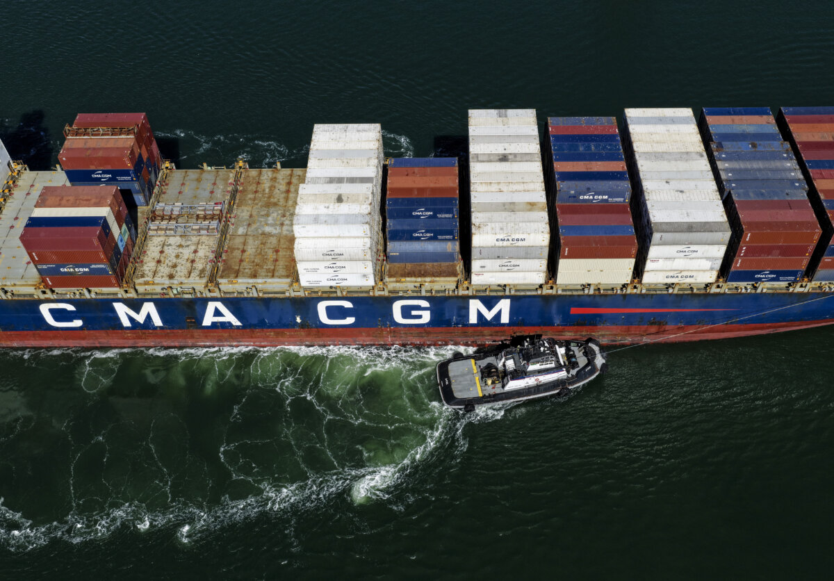 A container ship is assisted by a tugboat as it arrives at the Port of Oakland on Oct. 10, 2025. (Justin Sullivan/Getty Images)