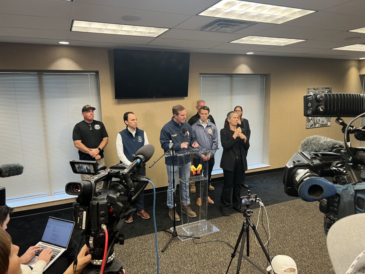 Louisville Mayor Craig Greenberg, Kentucky Gov. Andy Beshear and U.S Congressman Morgan McGarvey spoke to the media after they toured the crash site Wednesday afternoon. (Jacki Thrapp / The Epoch Times )
