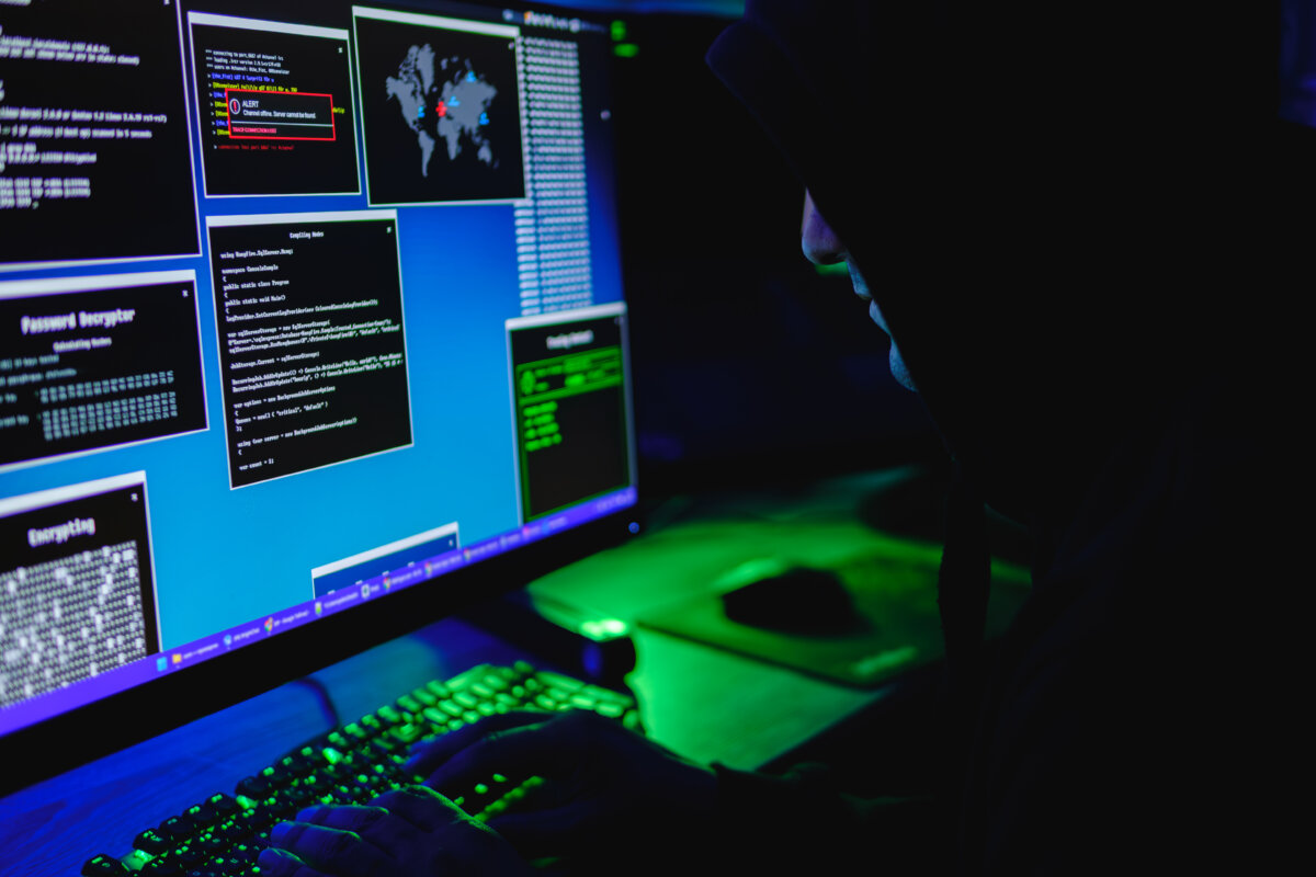 In this photo illustration, a hacker types on a computer keyboard on May 13, 2025. (Oleksii Pydsosonnii/The Epoch Times)
