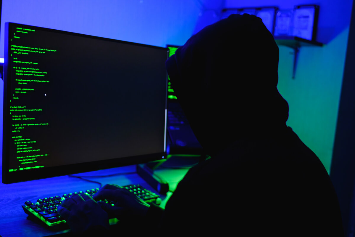 In this photo illustration, hacker types on a computer keyboard on May 13, 2025. (Oleksii Pydsosonnii/The Epoch Times)