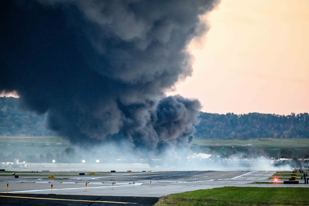 Fire and smoke mark where a UPS cargo plane crashed near Louisville Muhammad Ali International Airport in Louisville, Ky., on Nov. 4, 2025. (Stephen Cohen/Getty Images)