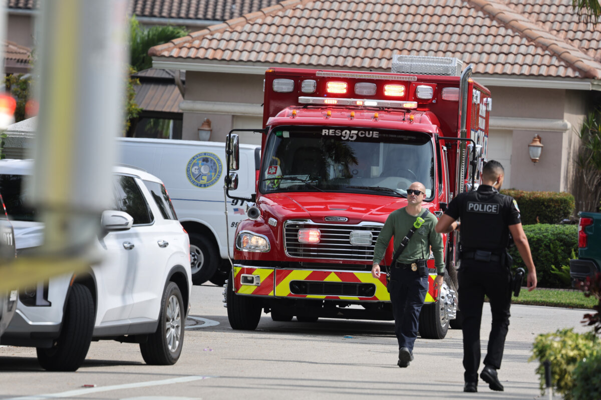 Emergency personnel from Coral Springs and Coconut Creek are on scene where a plane crashed in the Windsor Bay community in Coral Springs, Fla., on Nov. 10, 2025. (Carline Jean/South Florida Sun-Sentinel via AP)
