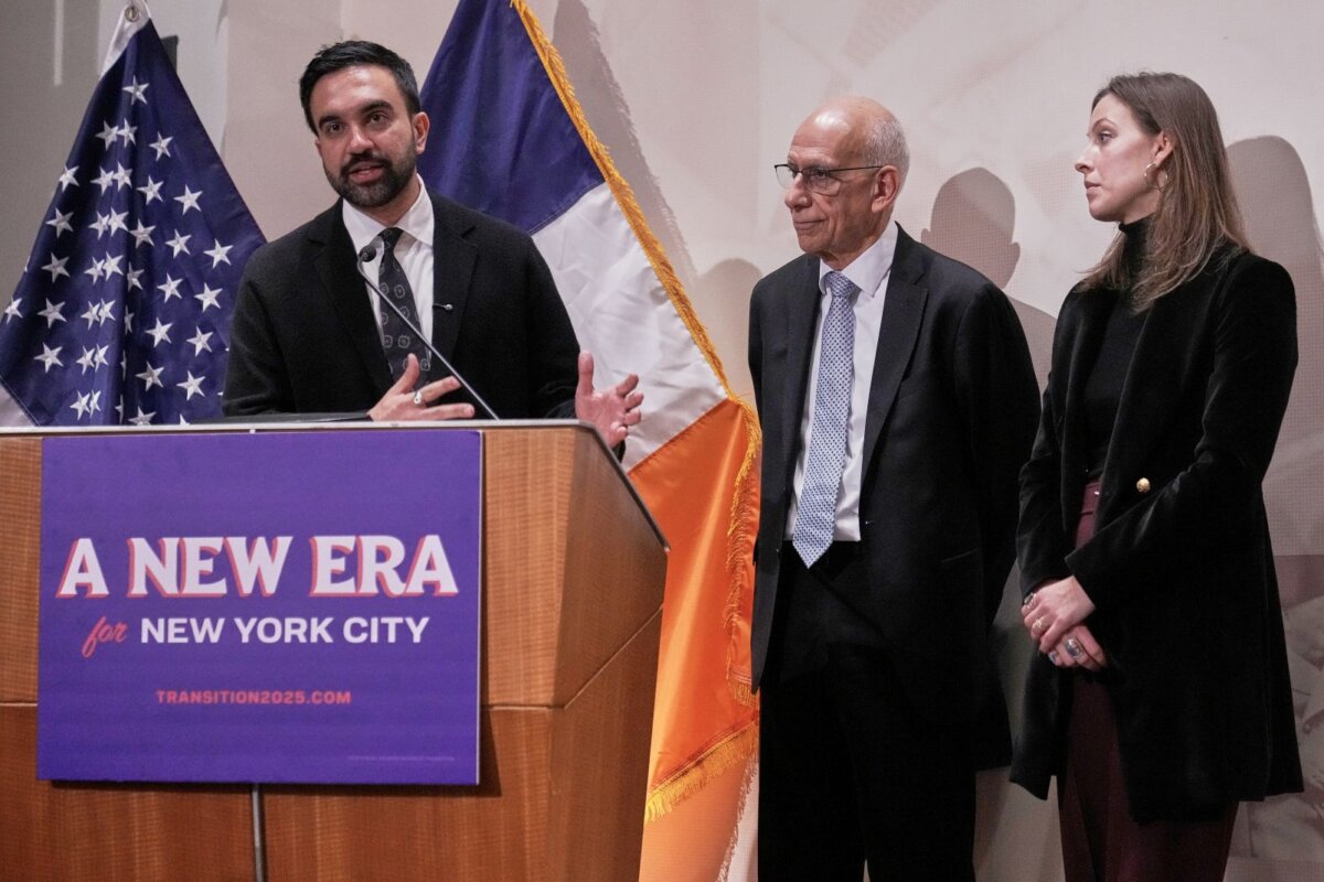New York Mayor-elect Zohran Mamdani, left, announces the appointment of Dean Fuleihan, center, as first deputy mayor and Elle Bisgaard-Church as chief of staff, in New York, on Nov. 10, 2025. (Richard Drew/AP Photo)