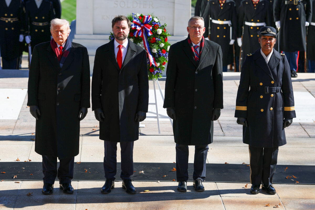 (L-R) President Donald Trump, Vice President JD Vance, Secretary of Veterans Affairs Doug Collins, and Brig. Gen. Antoinette Gant, commanding general of the Military District of Washington, participate in a wreath-laying ceremony at the Tomb of the Unknown Soldier at Arlington National Cemetery to mark Veterans Day in Arlington, Va., on Nov. 11, 2025. (Anna Moneymaker/Getty Images)