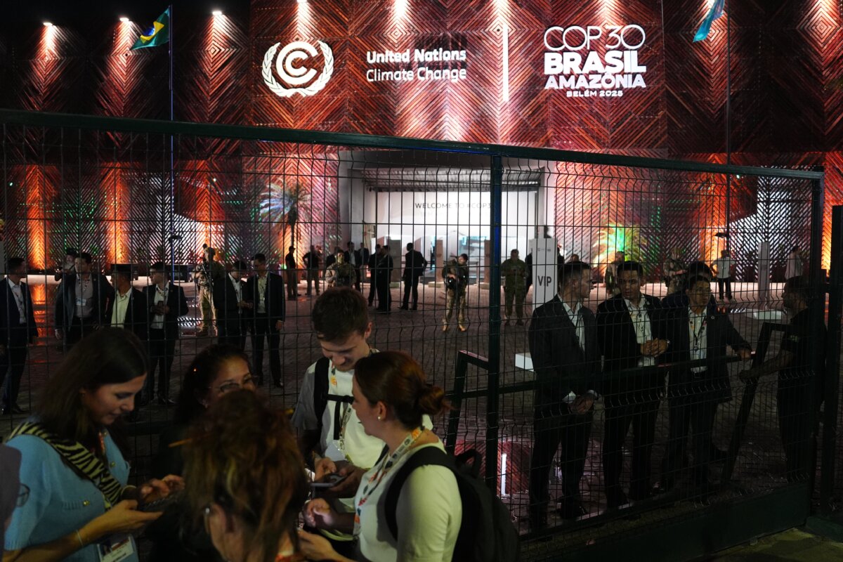 Security personnel (R) stand behind a fence outside the venue for the COP30 U.N. Climate Summit in Belem, Brazil, on Nov. 11, 2025. (Joshua A. Bickel/AP Photo)