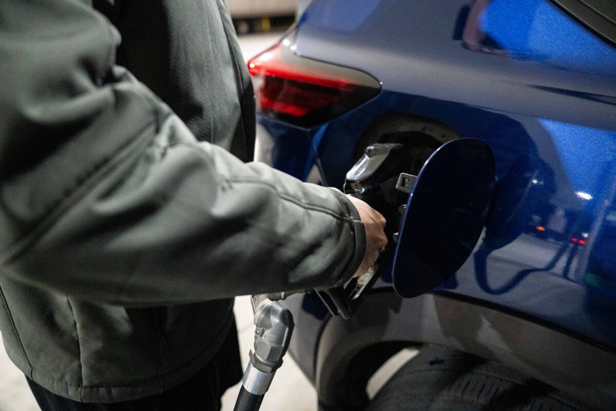 A man pumps gas at a gas station in Elkridge, Md., on Nov. 12, 2025. (Madalina Kilroy/The Epoch Times)