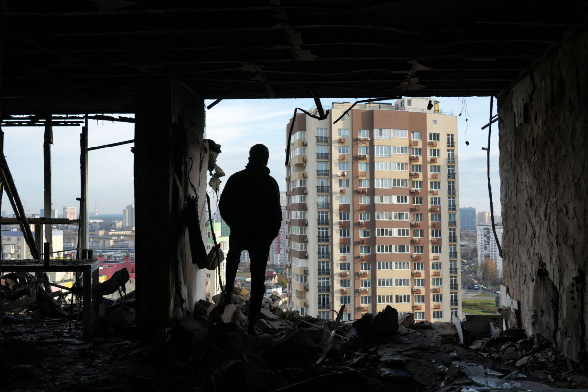 A man stands in a destroyed apartment after a Russian airstrike in Kyiv, Ukraine, on Nov. 14, 2025. (Oleksii Filippov/AFP via Getty Images)