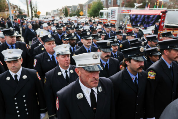 Day in Photos: Firefighter’s Funeral, Flooding in the UK, and Explosion in Argentina