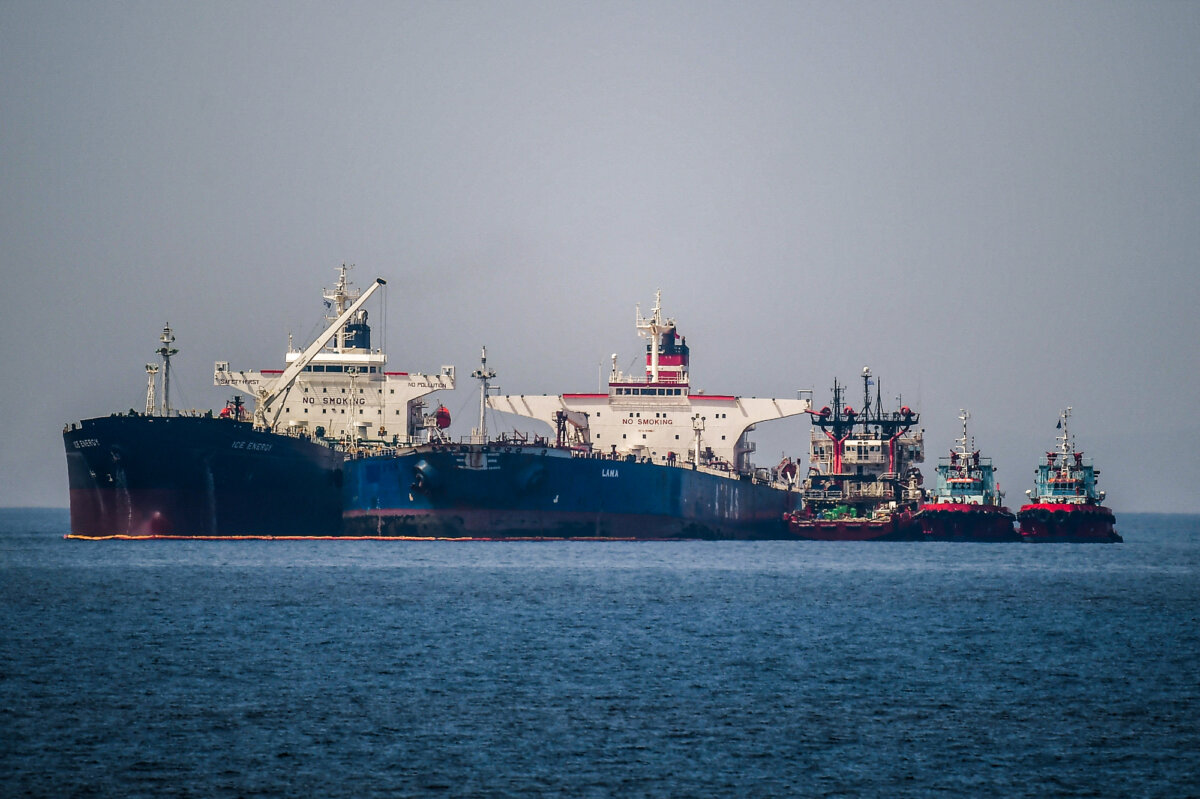 The Liberian-flagged oil tanker Ice Energy (L) transfers crude oil from the Russian-flagged oil tanker Lana (R) off the shore of Karystos, Greece, on May 29, 2022. (Angelos Tzortzinis/AFP)
