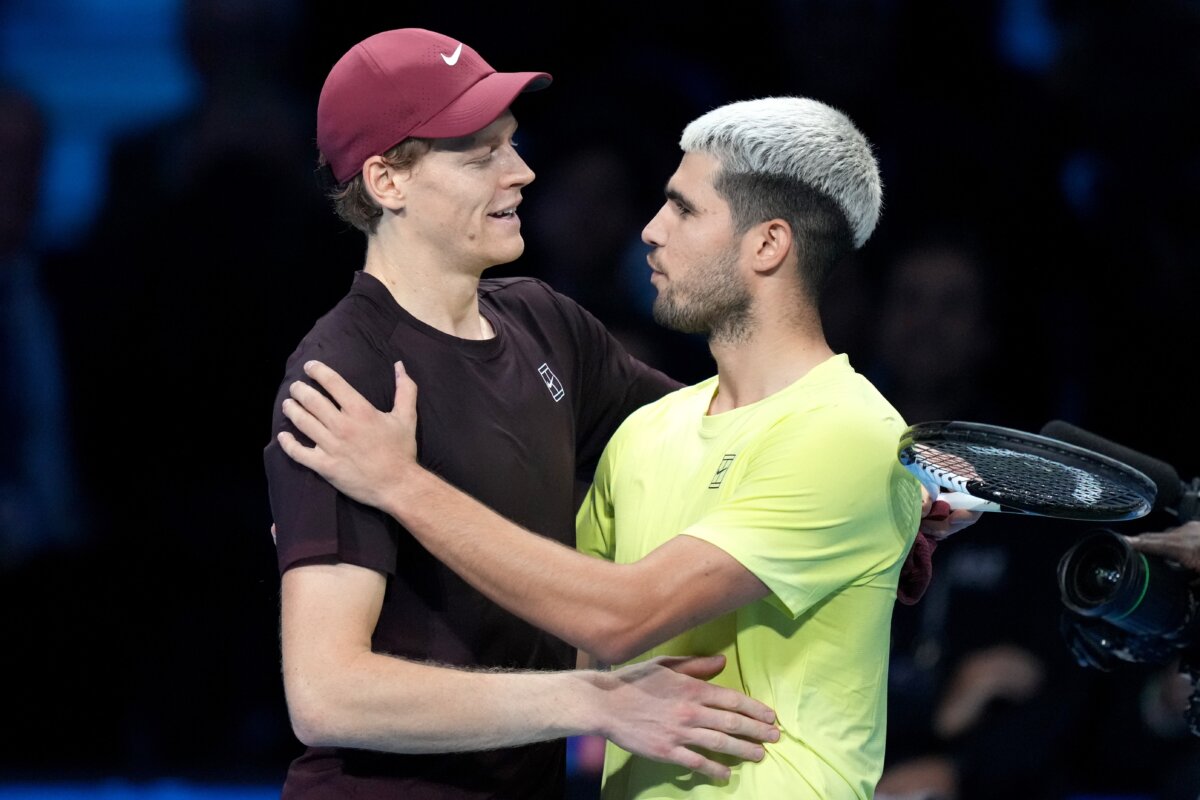 Italy's Jannik Sinner, left, and Spain's Carlos Alcaraz hug after the final tennis match of the ATP World Tour Finals, in Turin, Italy, Sunday, Nov. 16, 2025. (AP Photo/Antonio Calanni)