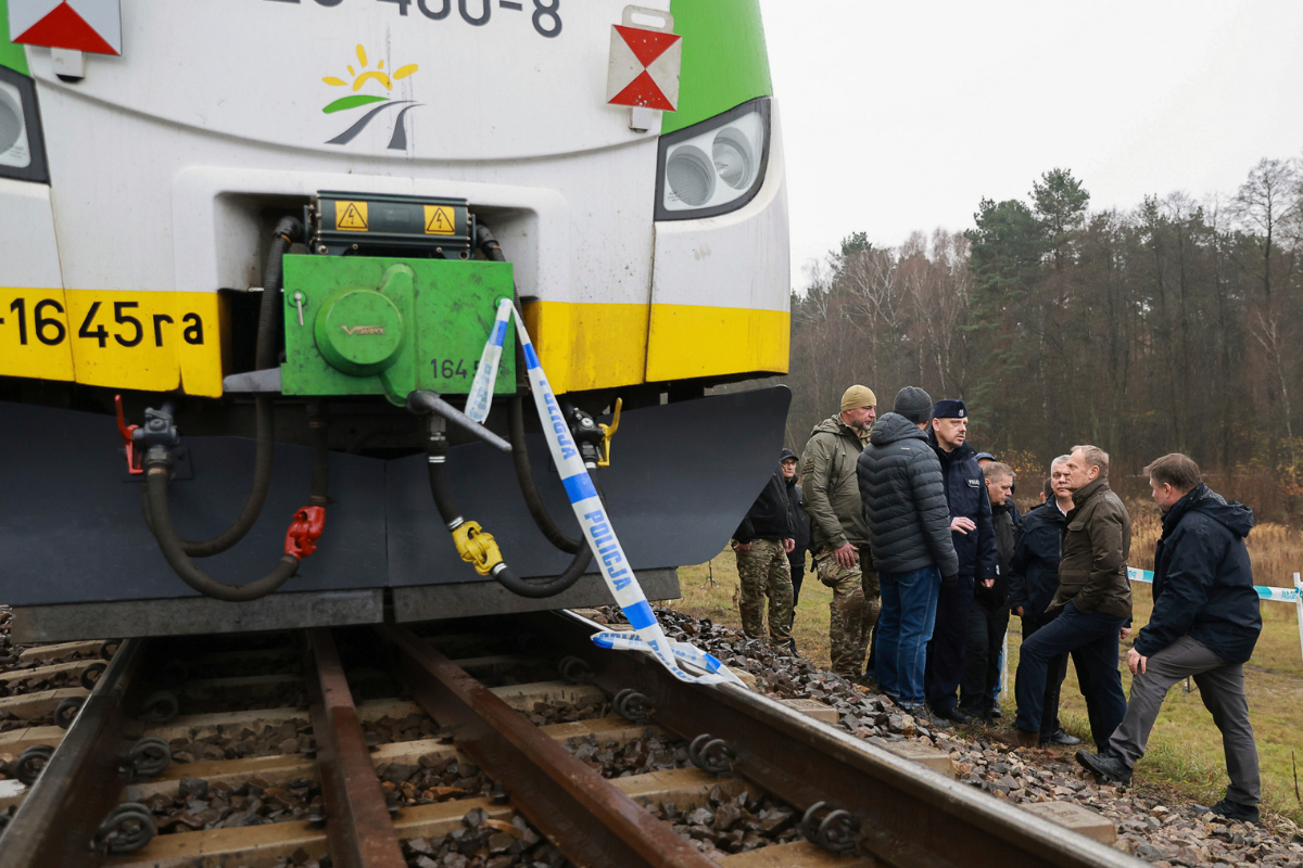 Polish Prime Minister Donald Tusk (2nd R) visits the site of the rail line near Mika that was damaged by sabotage in Poland on Nov. 17, 2025. (KPRM/AP Photo)