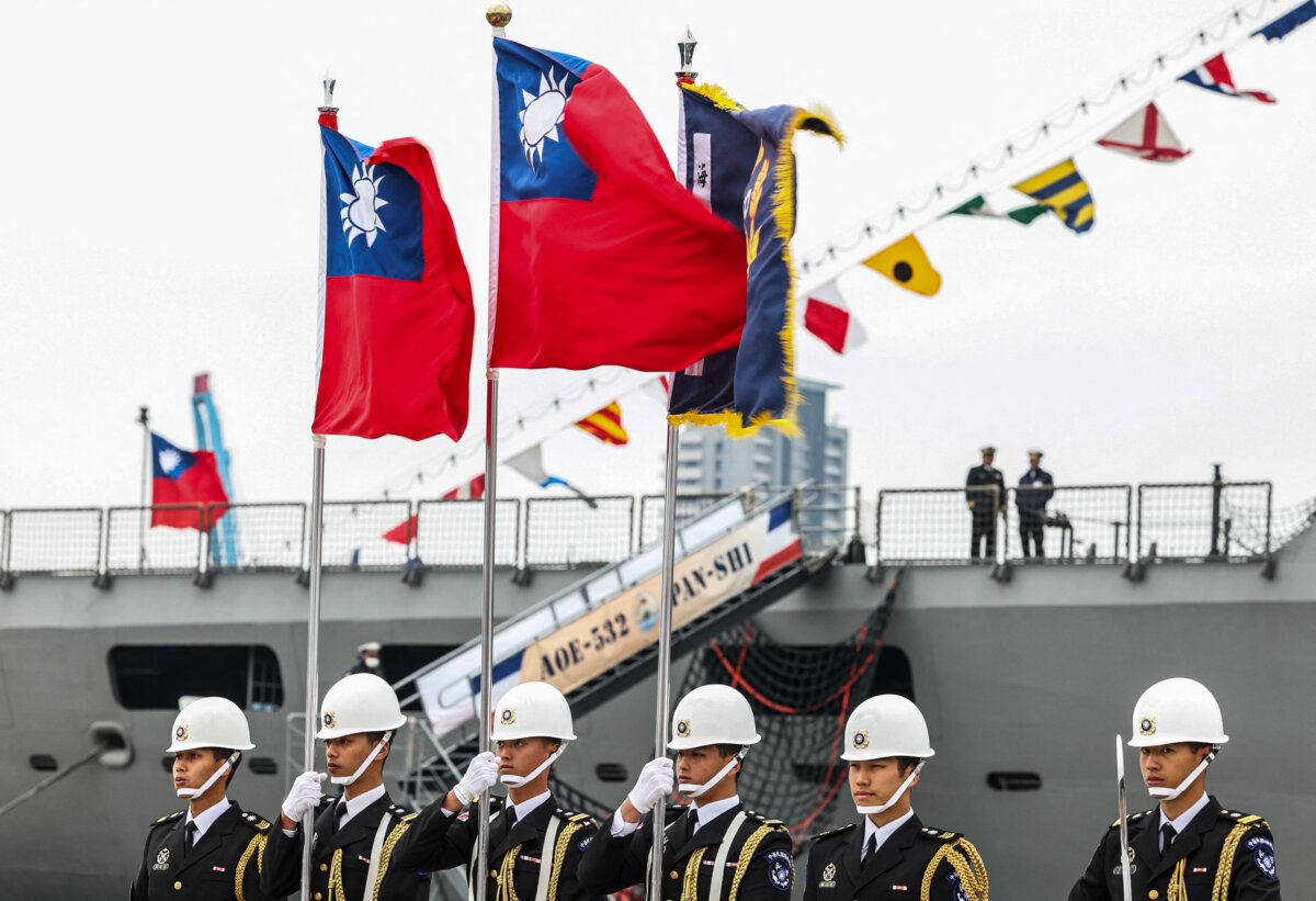 Members of the Taiwanese honor guard hold Taiwanese flags during an open day event for the public at Keelung Port in Taiwan on March 17, 2025. (I-haw Cheng /AFP via Getty Images)