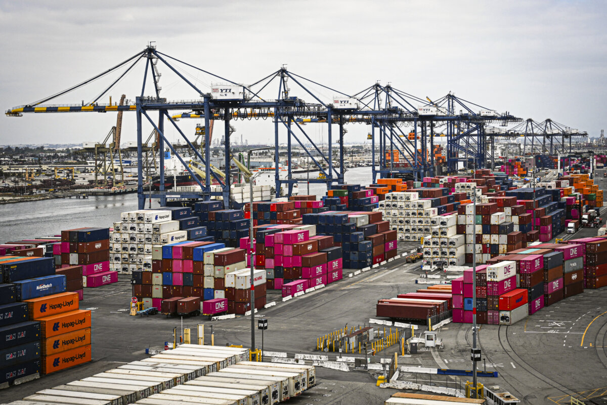 Shipping containers are stacked as cranes unload cargo ships at the Port of Los Angeles in San Pedro, Calif., on April 15, 2025. (Patrick T. Fallon/AFP via Getty Images)