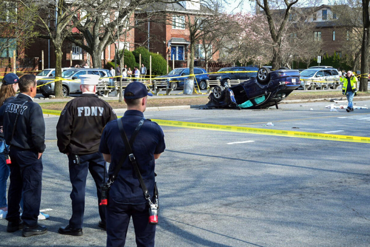The scene, on March 29, 2025, in the Brooklyn borough of New York, where a woman driving on a suspended license was speeding and failed to yield after stopping at a red light, collided with another vehicle and then into a family walking on the crosswalk. (Mayoral Photography Office/Justin Persaud via AP)