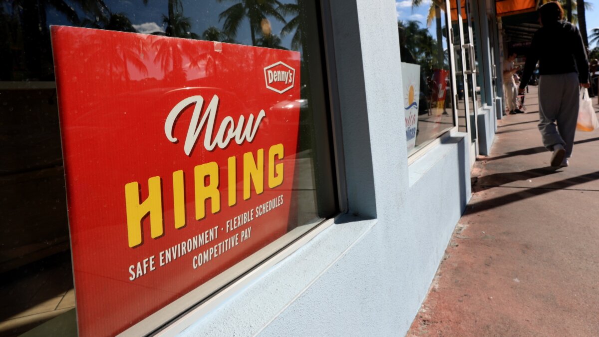 A 'Now Hiring' sign in the window of a Denny's restaurant in Miami, Fla., on Nov. 19, 2025. (Joe Raedle/Getty Images)
