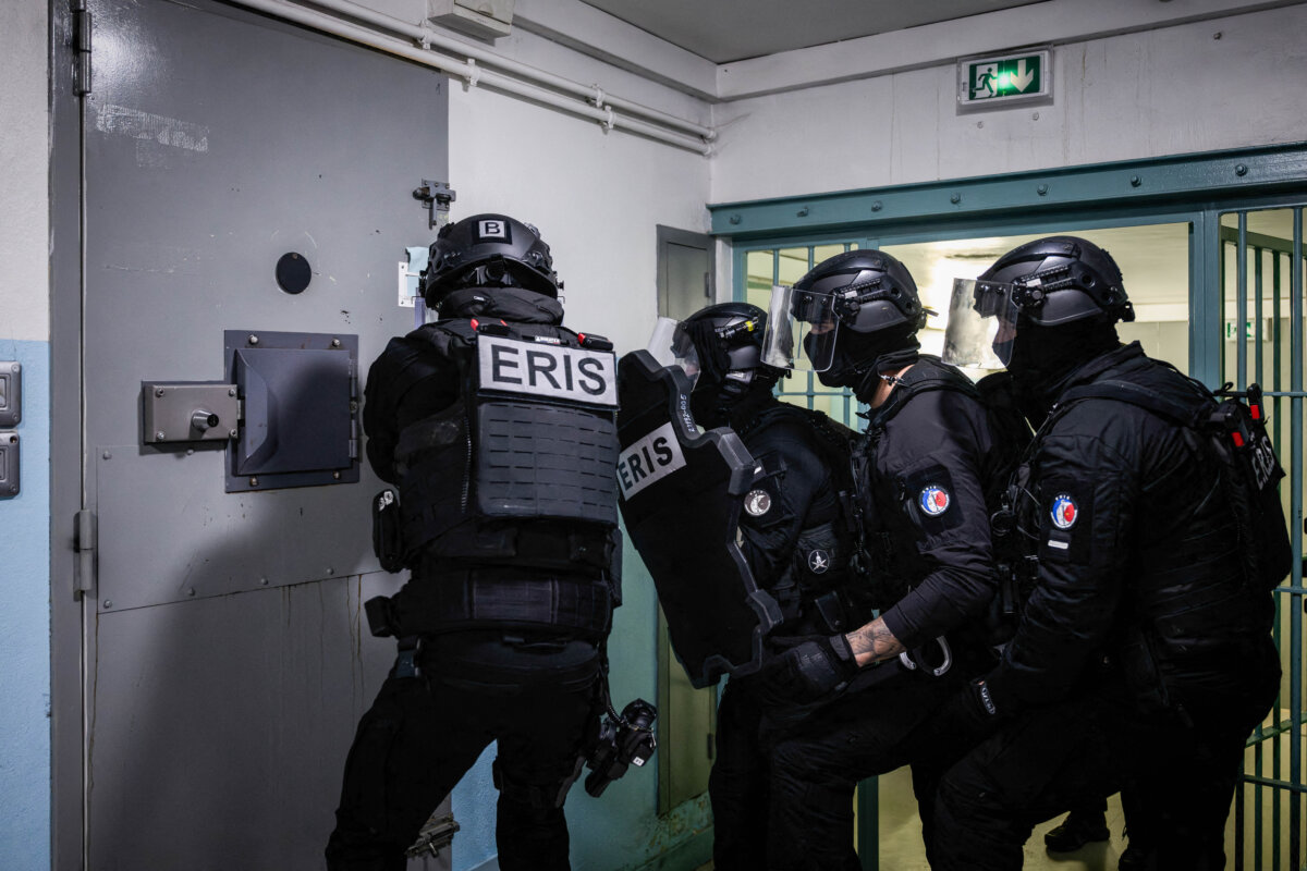 Members of the Regional Intervention and Security Teams open the cell of a high-security inmate before his transfer from Gradignan Prison to the newly operational high-security prison of Conde-sur-Sarthe, in Gradignan, southwestern France, on Nov. 20, 2025. (Philippe Lopez/AFP via Getty Images)