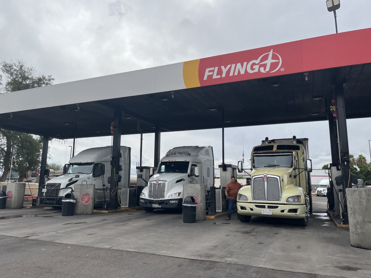 California truck driver Alex Cardona fuels his semitruck at the Flying J truck stop in Phoenix, Ariz., on Nov. 19, 2025. (Allan Stein/The Epoch Times)