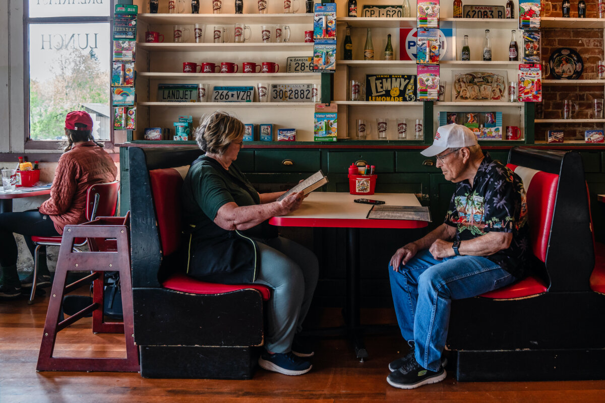 A couple looks at the menus at Miner's Diner in Julian, Calif., on April 14, 2025. (Ariana Drehsler/Getty Images)