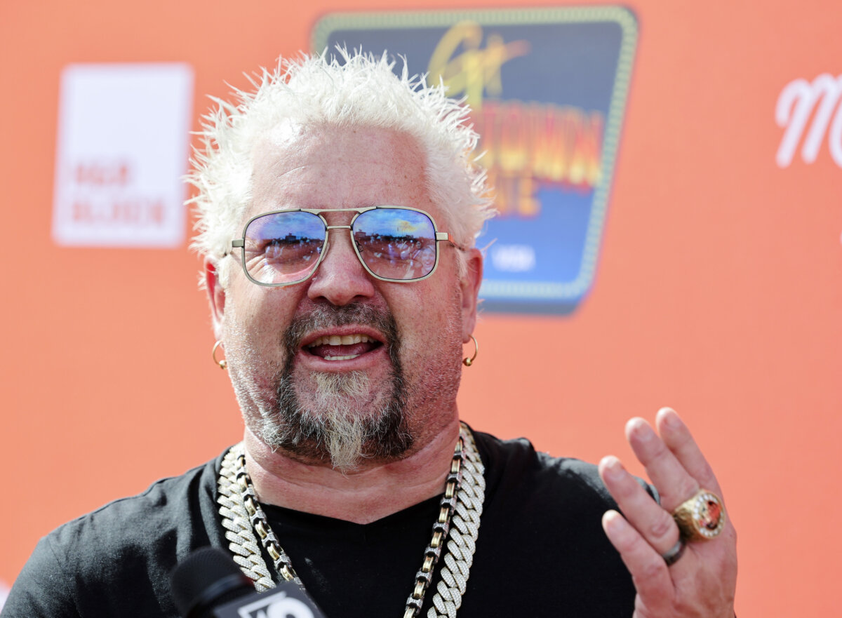 Guy Fieri is interviewed at Guy Fieri's Flavortown Tailgate in Glendale, Ariz., on Feb. 12, 2023. (Ethan Miller/Getty Images)