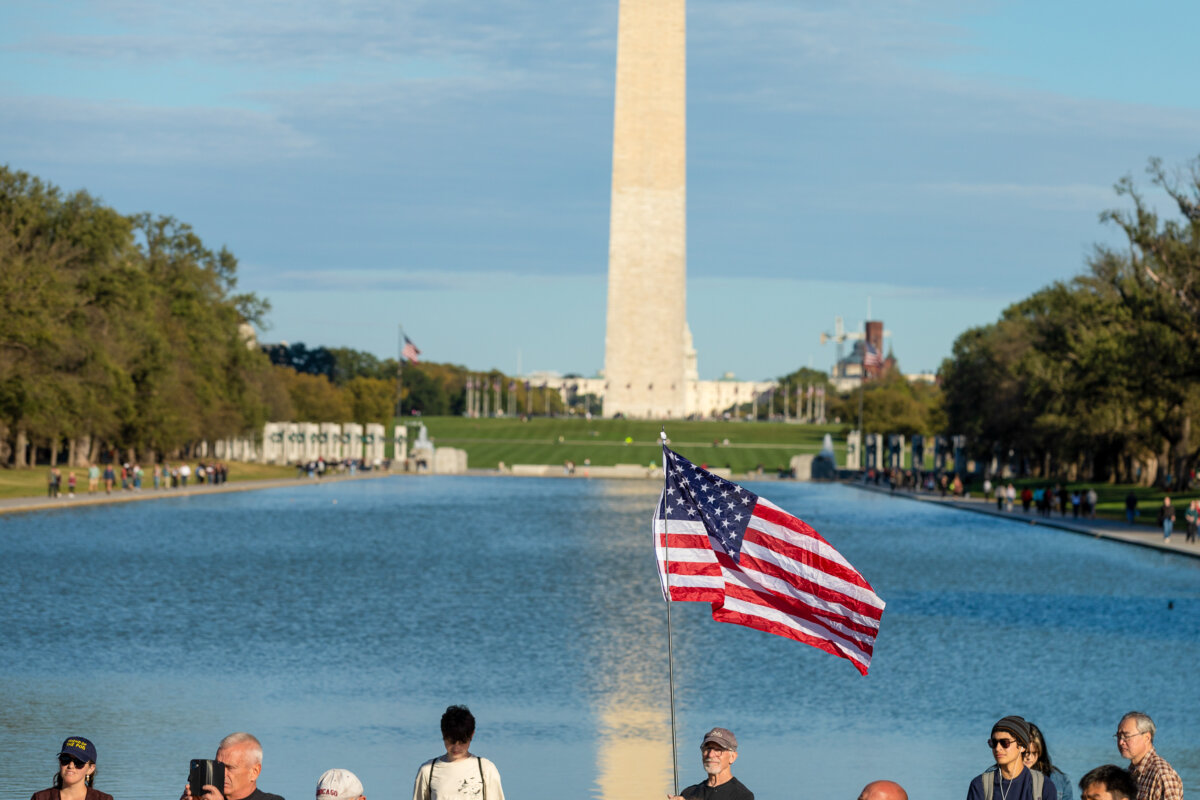 A man waves an American flag during a rally at the Lincoln Memorial in Washington on Oct. 17, 2025. (Anna Rose Layden/Getty Images)