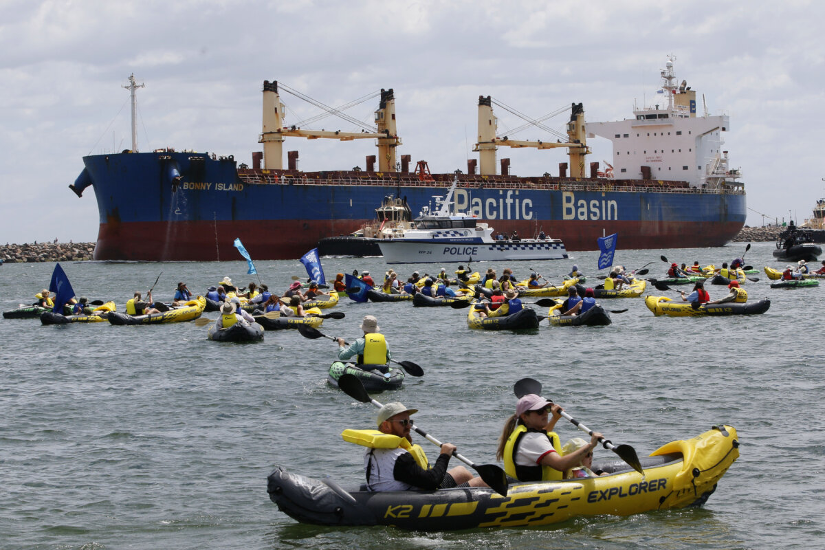 Protesters take part in the Rising Tide People's Blockade at Horseshoe beach in Newcastle, Australia, on Nov. 30, 2025. (AAP Image/Darren Pateman)