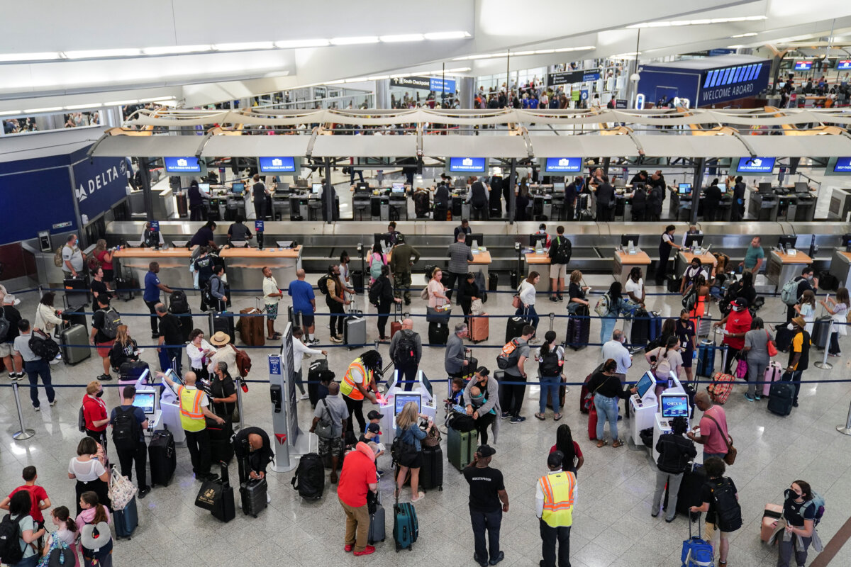 Passengers are seen at check-in counters at Hartsfield-Jackson Atlanta International Airport in Atlanta, Ga., on July 1, 2022. (Elijah Nouvelage/Reuters)