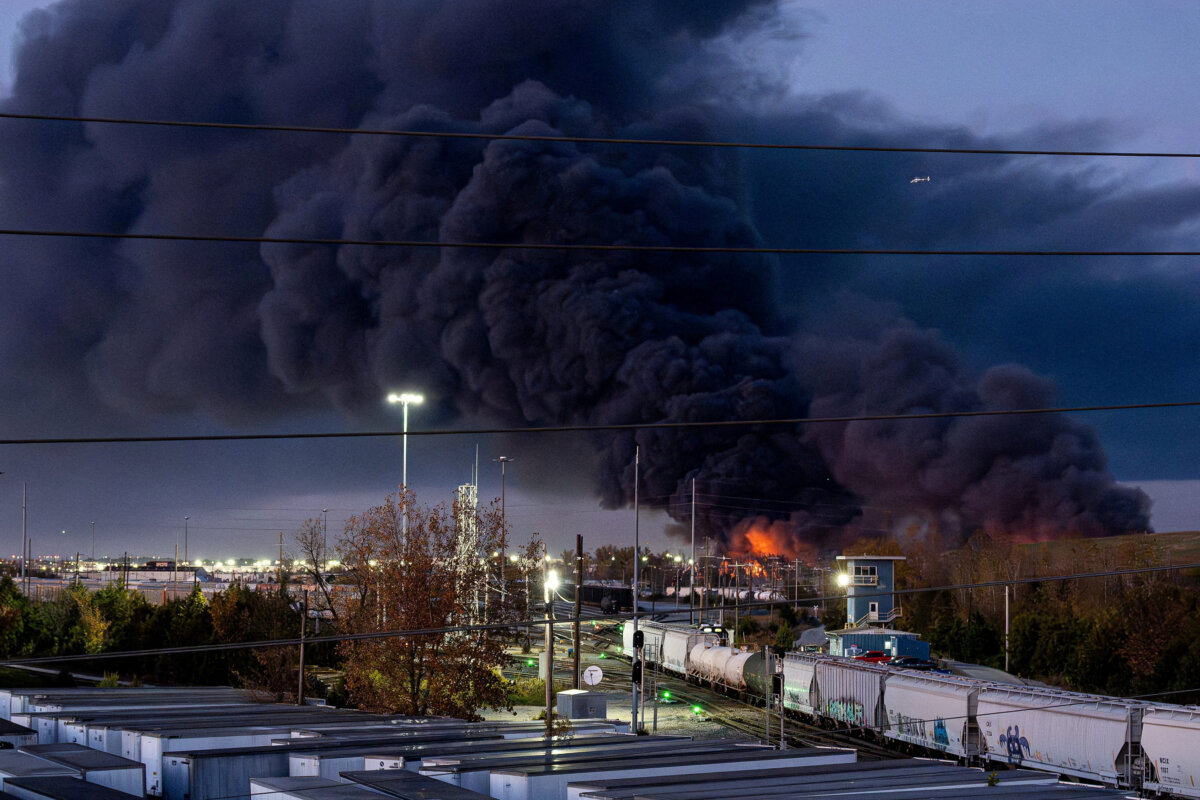 Smoke rises from the wreackage of a UPS MD-11 cargo jet after it crashed on departure from Louisville Muhammad Ali International Airport in Louisville, Kentucky, U.S. November 4, 2025. Jeff Faughender/USA Today Network via REUTERS/File Photo
